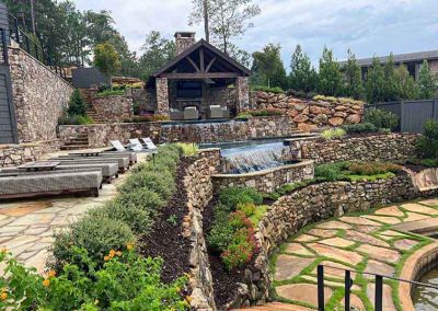 Challenging Sloped Design For Pool On Lake With Retaining Walls And Gardens